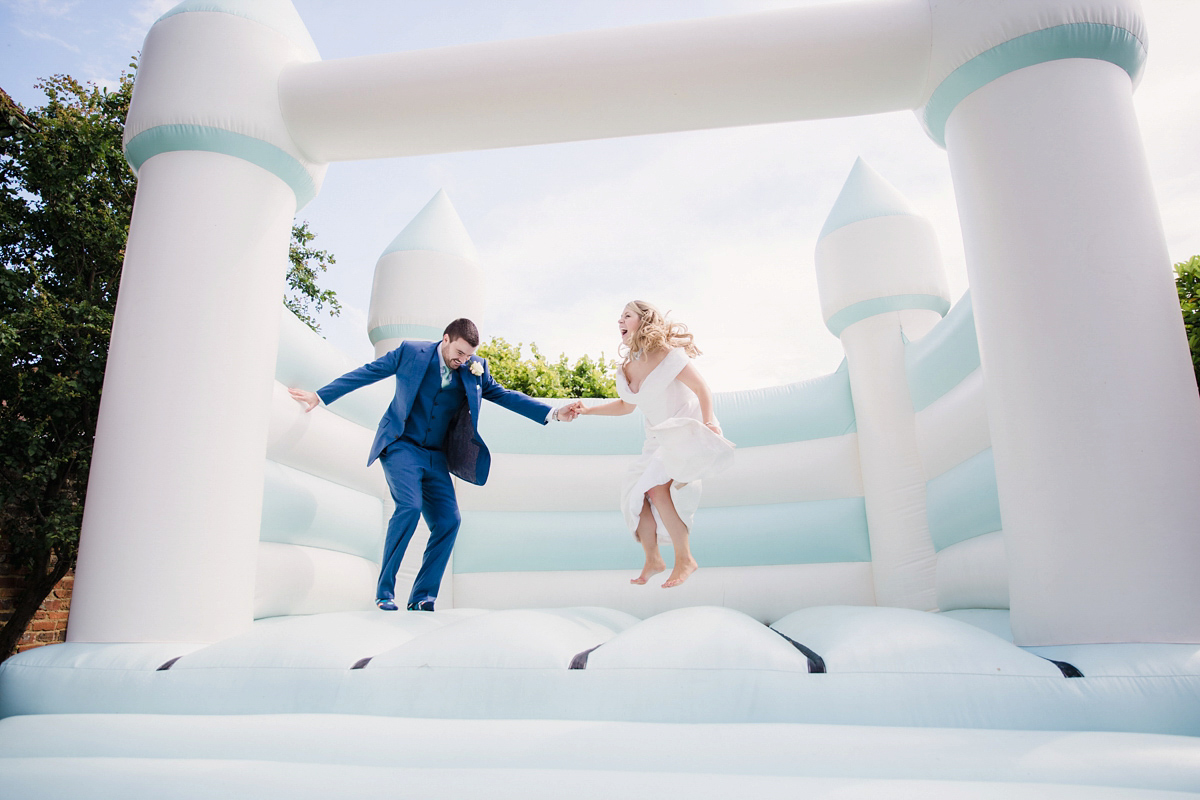 Liz wore a Vivienne Westwood dress for her hot air balloon and travel inspired wedding ('Around the World in 80 Days', Phileas Fogg style). A Lillibrooke Hall summer barn wedding, photographed by Faye Cornhill.