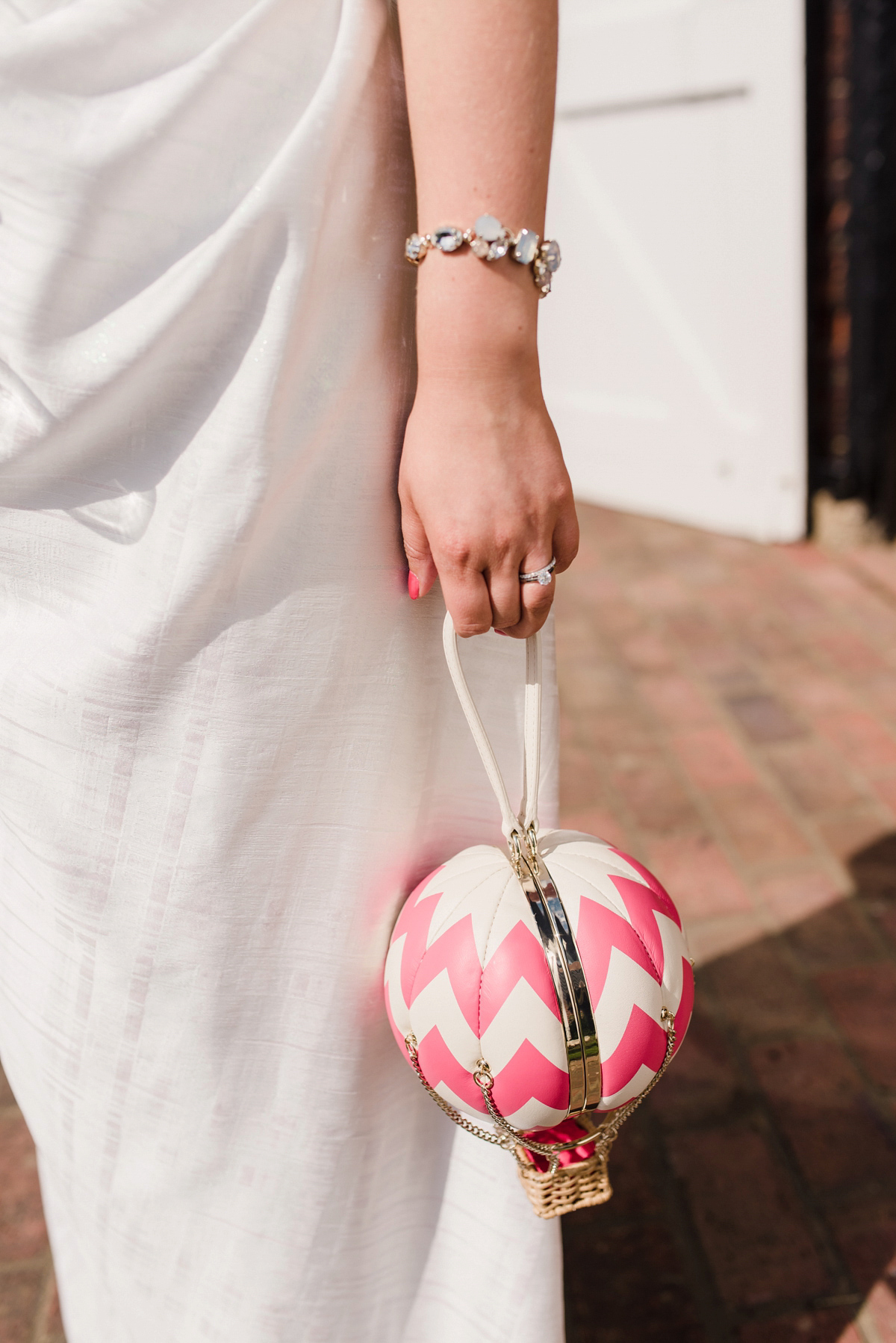 Liz wore a Vivienne Westwood dress for her hot air balloon and travel inspired wedding ('Around the World in 80 Days', Phileas Fogg style). A Lillibrooke Hall summer barn wedding, photographed by Faye Cornhill.