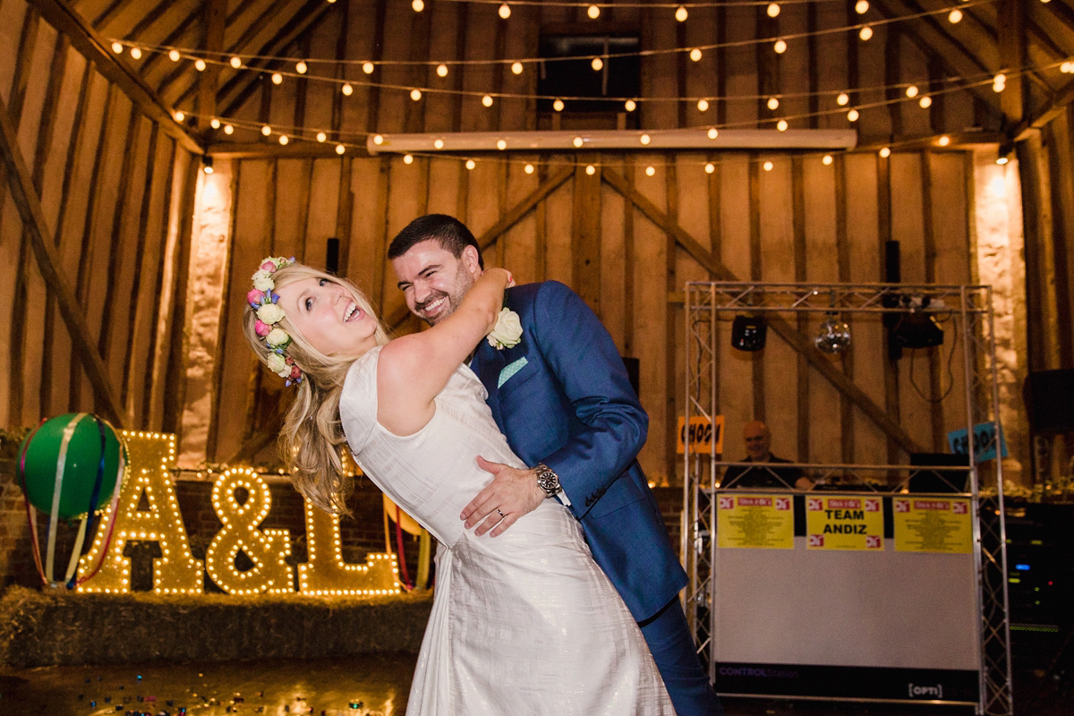 Liz wore a Vivienne Westwood dress for her hot air balloon and travel inspired wedding ('Around the World in 80 Days', Phileas Fogg style). A Lillibrooke Hall summer barn wedding, photographed by Faye Cornhill.