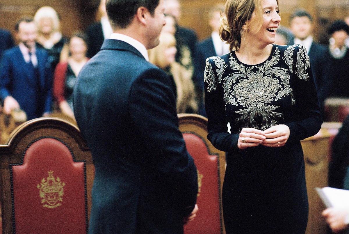 Leanne wears a navy blue Alexander McQueen dress for her modern and stylish, non traditional London wedding. A First look wedding captured on film by Peachey Photography.