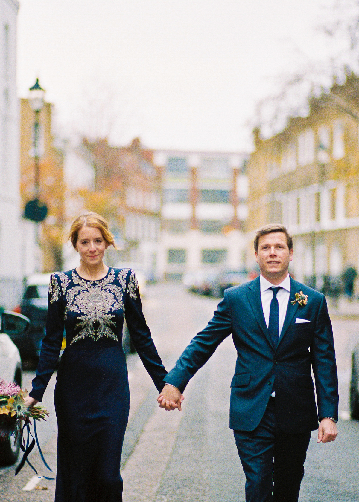 Leanne wears a navy blue Alexander McQueen dress for her modern and stylish, non traditional London wedding. A First look wedding captured on film by Peachey Photography.