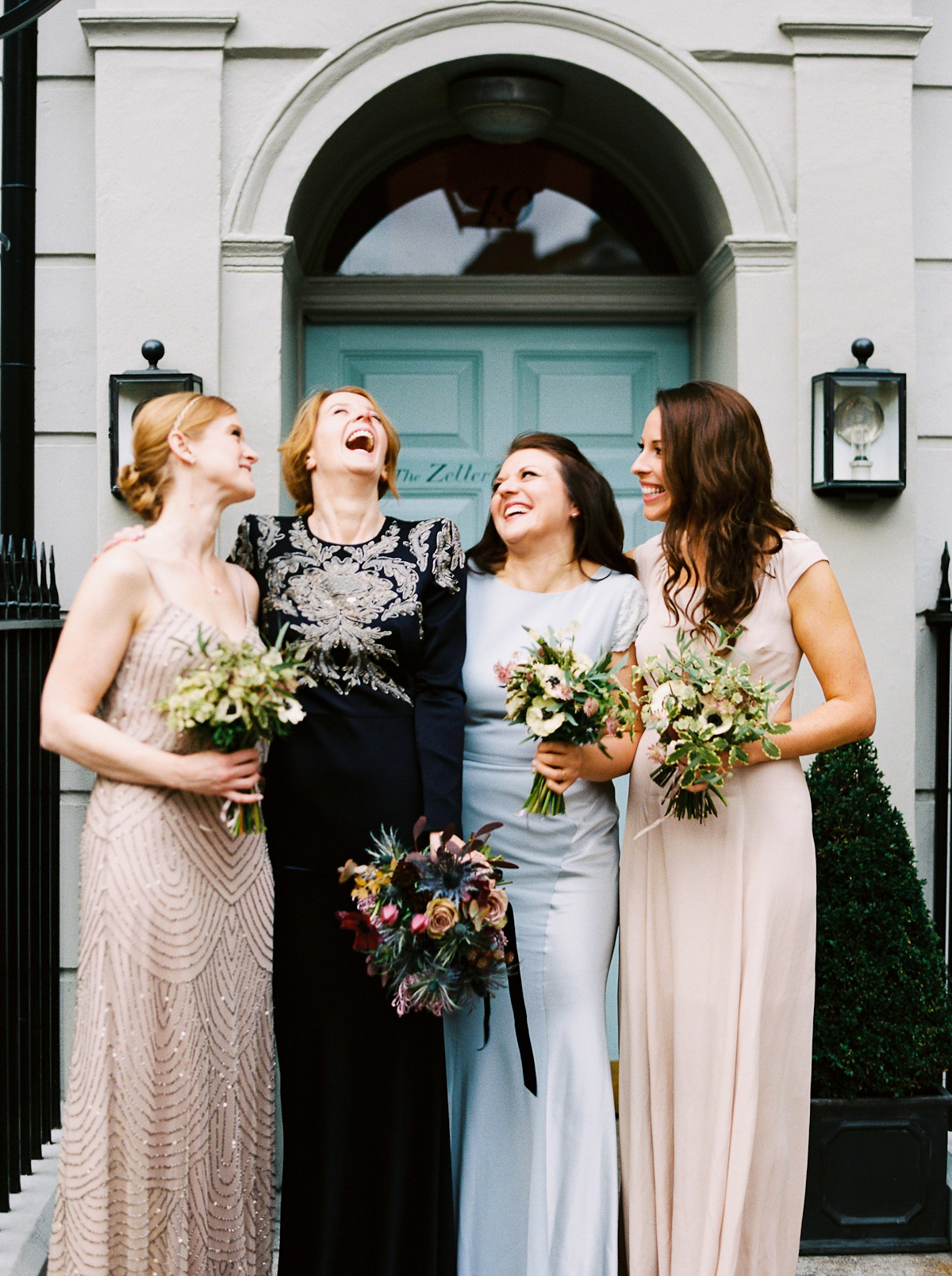 Leanne wears a navy blue Alexander McQueen dress for her modern and stylish, non traditional London wedding. A First look wedding captured on film by Peachey Photography.