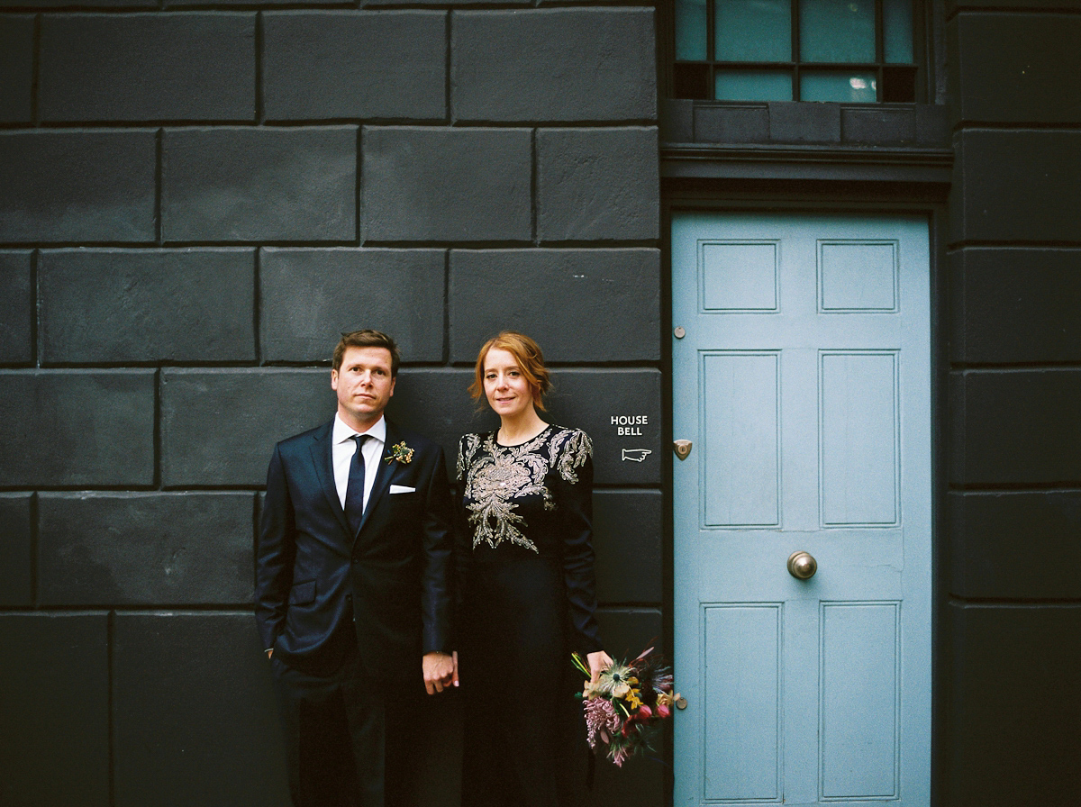 Leanne wears a navy blue Alexander McQueen dress for her modern and stylish, non traditional London wedding. A First look wedding captured on film by Peachey Photography.