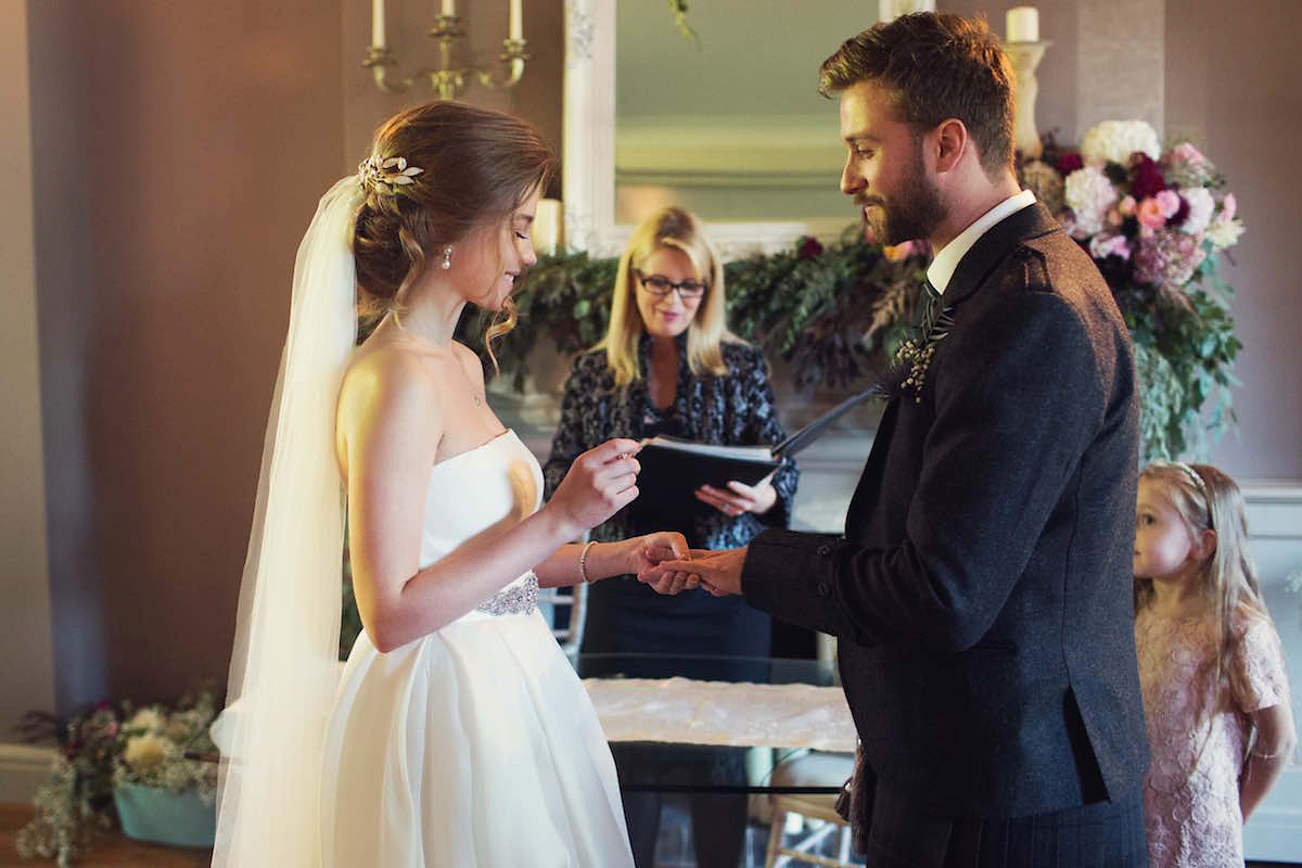 Anastasia wore a Jesus Peiro gown and Badgley Mischka shoes for her feminine, romantic and elegant country house wedding in Autumn.