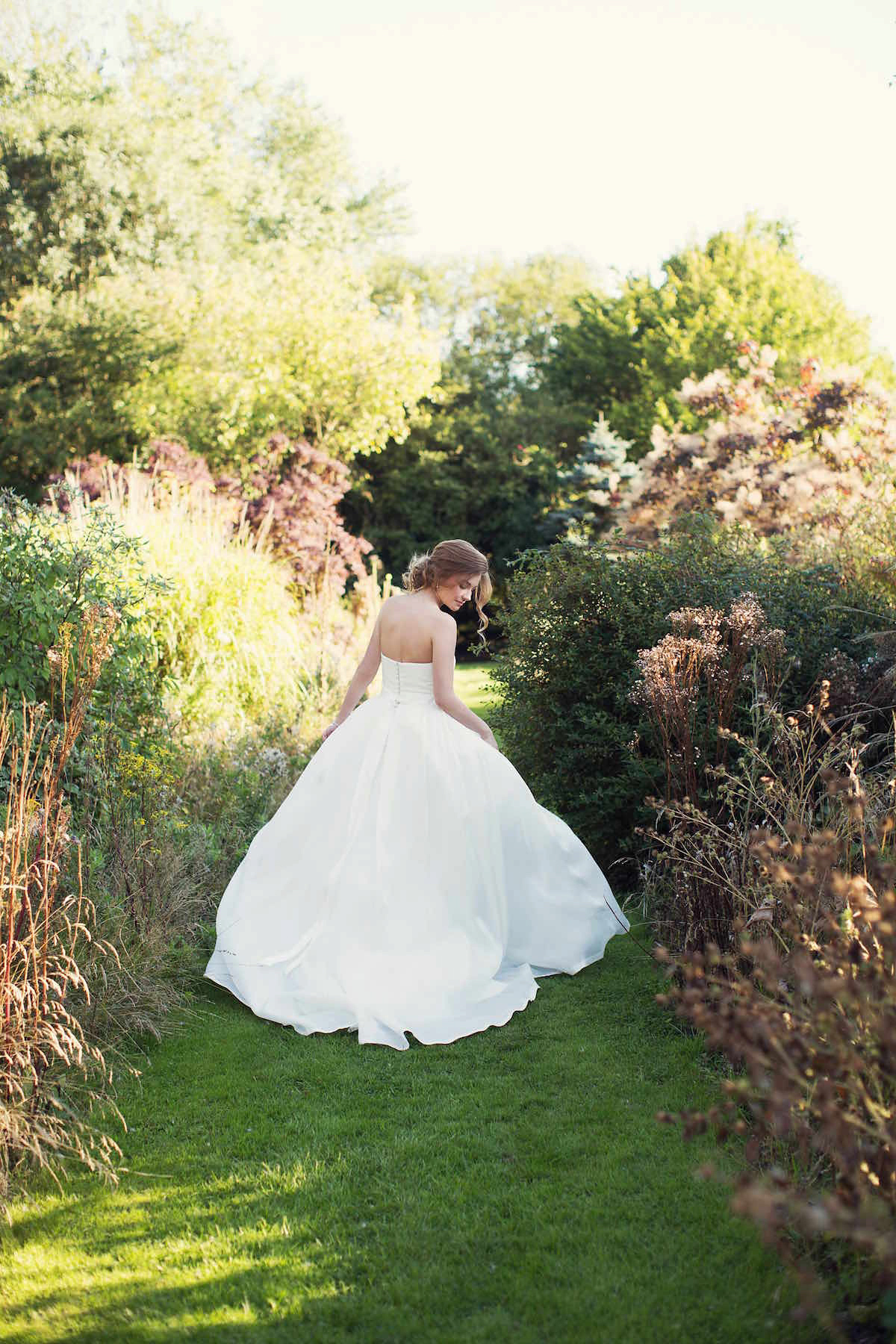 Anastasia wore a Jesus Peiro gown and Badgley Mischka shoes for her feminine, romantic and elegant country house wedding in Autumn.