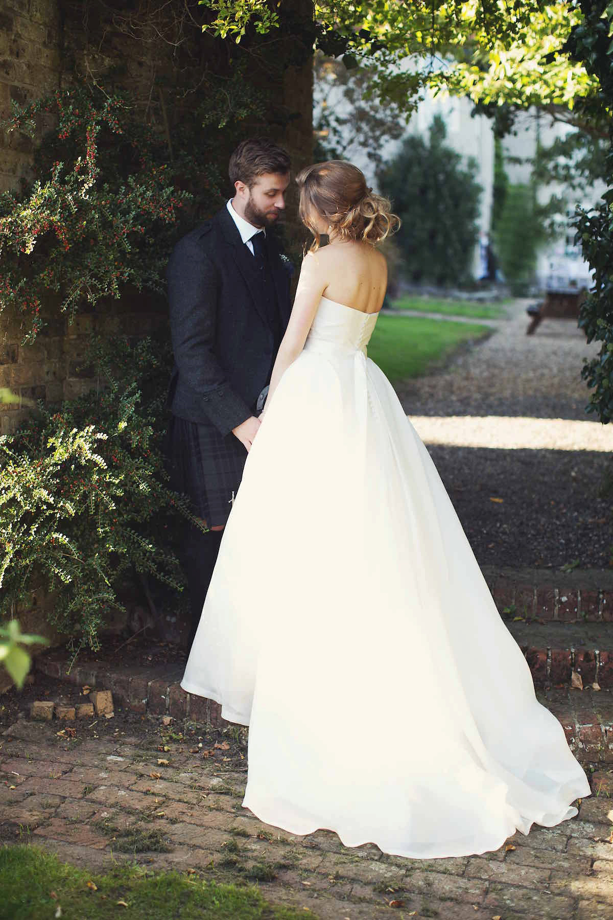 Anastasia wore a Jesus Peiro gown and Badgley Mischka shoes for her feminine, romantic and elegant country house wedding in Autumn.