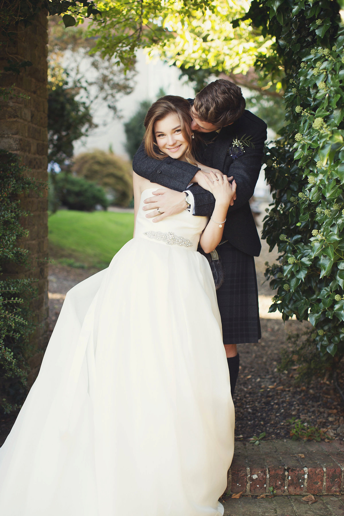 Anastasia wore a Jesus Peiro gown and Badgley Mischka shoes for her feminine, romantic and elegant country house wedding in Autumn.