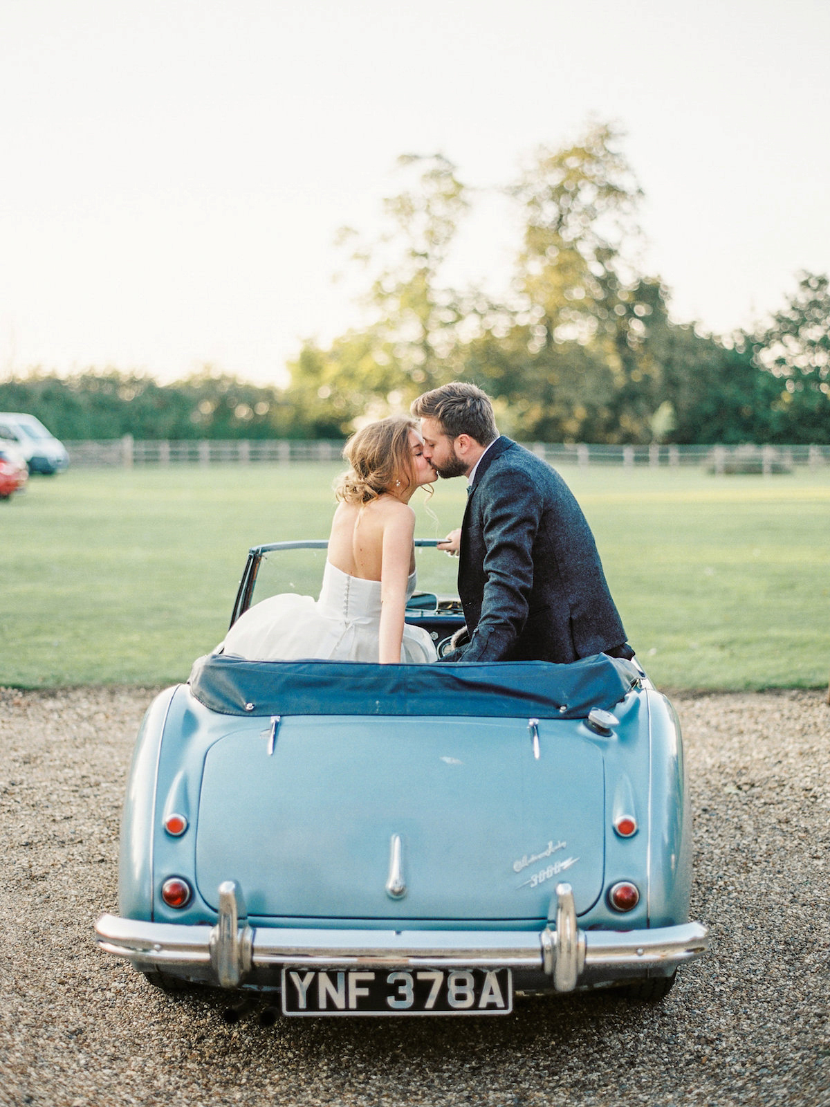 Anastasia wore a Jesus Peiro gown and Badgley Mischka shoes for her feminine, romantic and elegant country house wedding in Autumn.