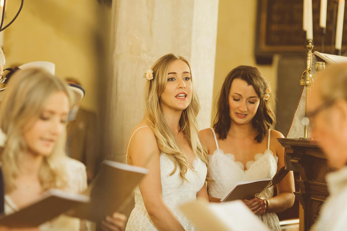 Bride Anna wore a feminine and bohemian inspired Rembo Styling dress for her wedding at her husbands family home in Devon. Photography by Jay Rowden.