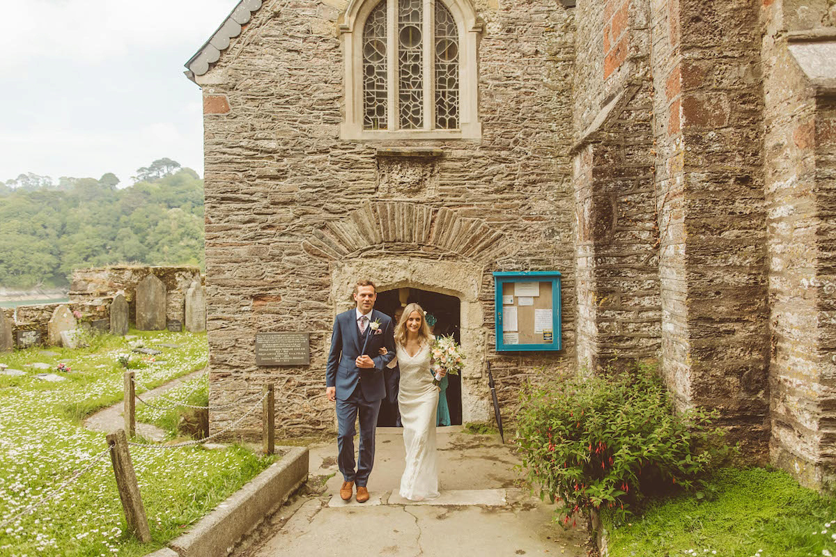 Bride Anna wore a feminine and bohemian inspired Rembo Styling dress for her wedding at her husbands family home in Devon. Photography by Jay Rowden.