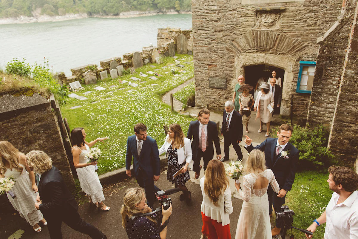 Bride Anna wore a feminine and bohemian inspired Rembo Styling dress for her wedding at her husbands family home in Devon. Photography by Jay Rowden.