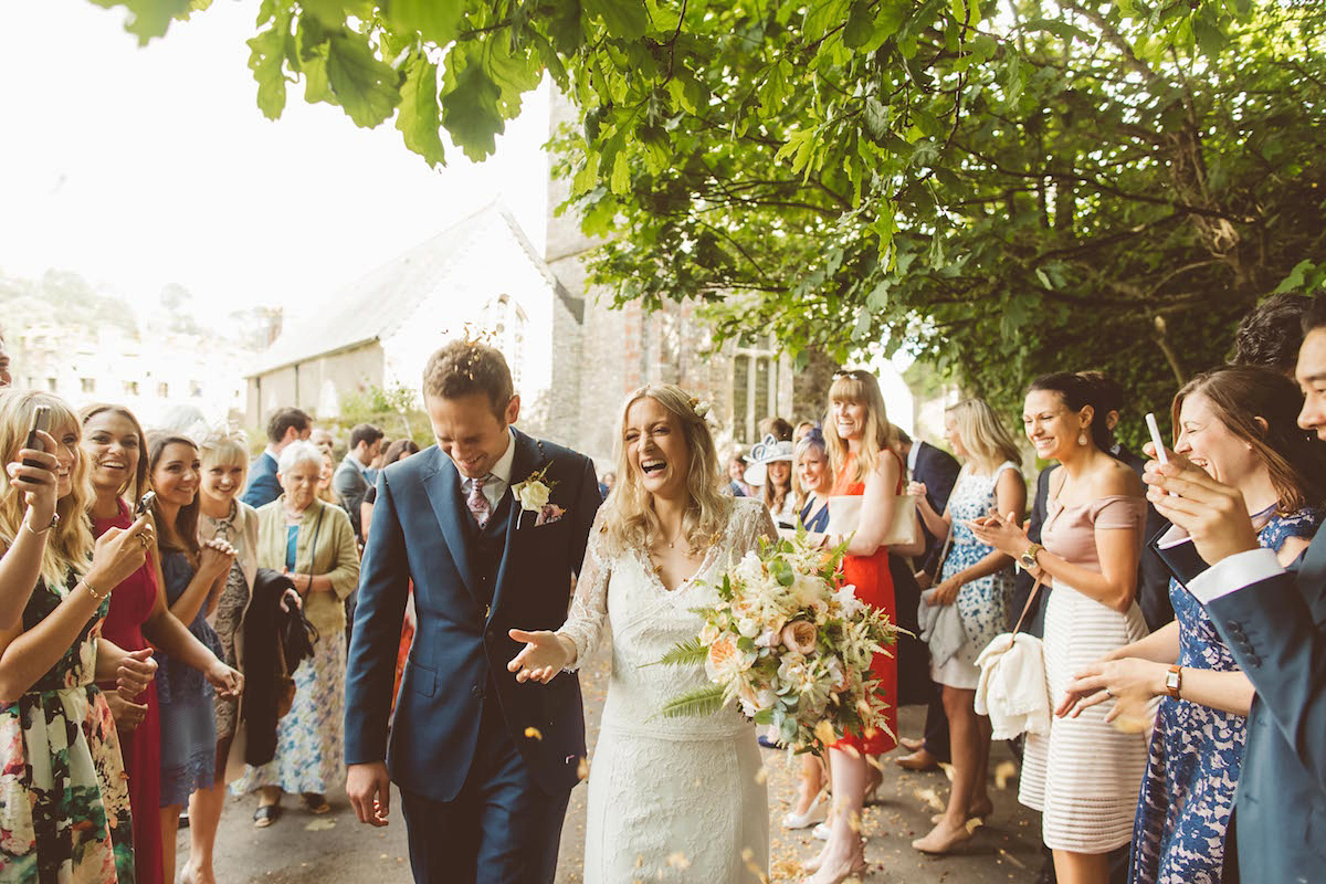 Bride Anna wore a feminine and bohemian inspired Rembo Styling dress for her wedding at her husbands family home in Devon. Photography by Jay Rowden.