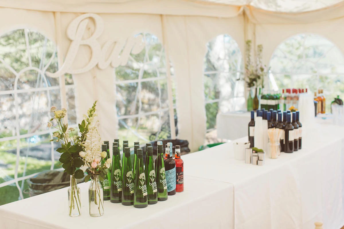 Bride Anna wore a feminine and bohemian inspired Rembo Styling dress for her wedding at her husbands family home in Devon. Photography by Jay Rowden.