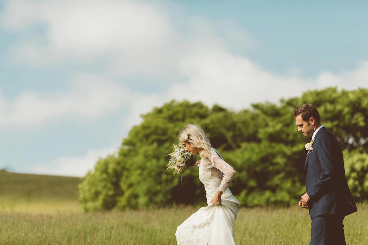 Bride Anna wore a feminine and bohemian inspired Rembo Styling dress for her wedding at her husbands family home in Devon. Photography by Jay Rowden.