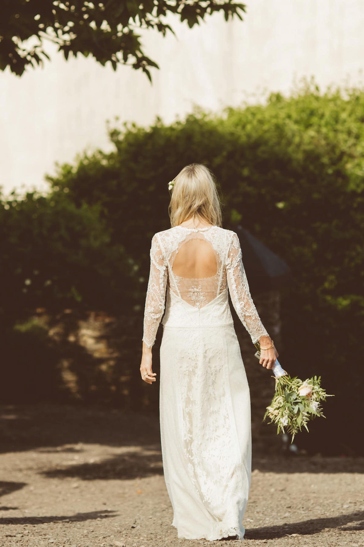 Bride Anna wore a feminine and bohemian inspired Rembo Styling dress for her wedding at her husbands family home in Devon. Photography by Jay Rowden.