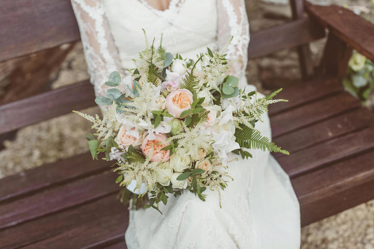 Bride Anna wore a feminine and bohemian inspired Rembo Styling dress for her wedding at her husbands family home in Devon. Photography by Jay Rowden.