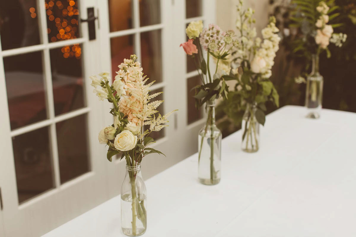 Bride Anna wore a feminine and bohemian inspired Rembo Styling dress for her wedding at her husbands family home in Devon. Photography by Jay Rowden.