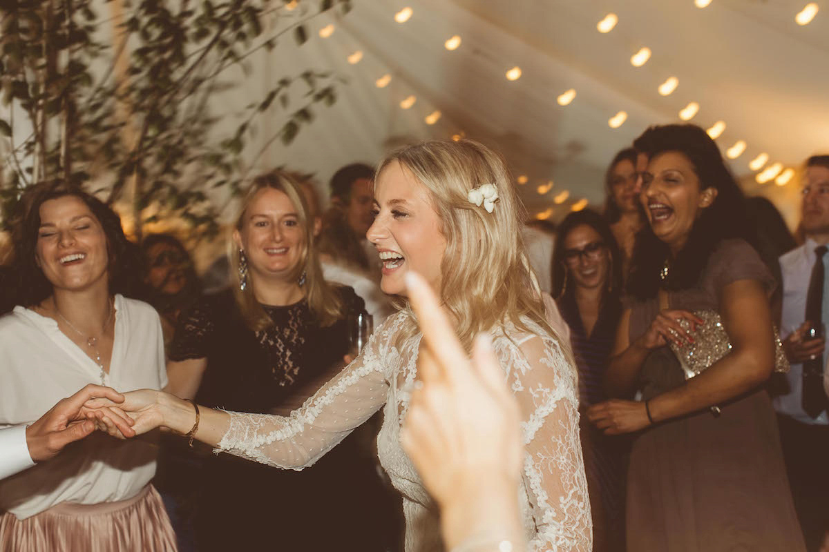 Bride Anna wore a feminine and bohemian inspired Rembo Styling dress for her wedding at her husbands family home in Devon. Photography by Jay Rowden.