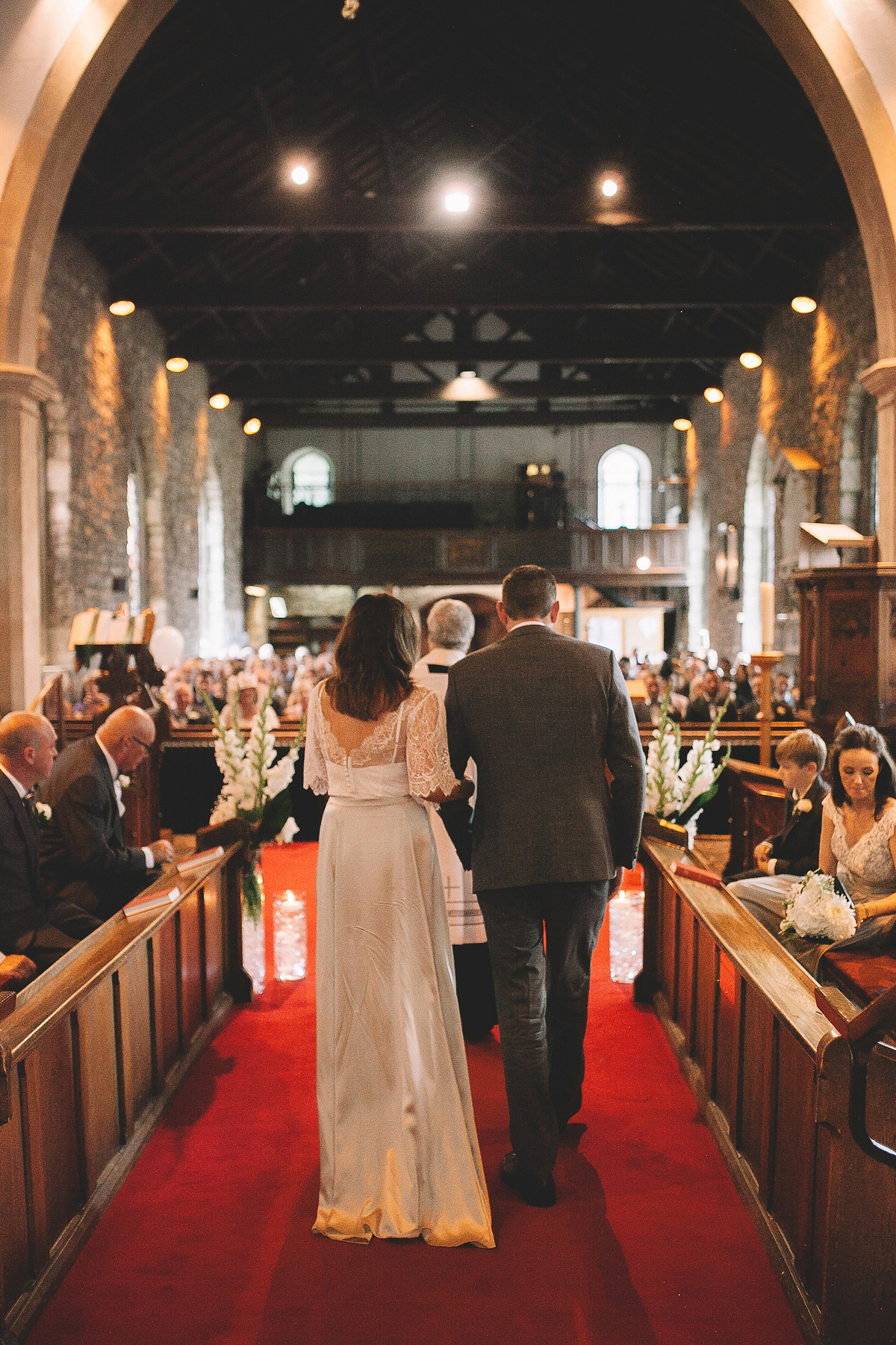 Bride Joanna wore an elegant Kate Beaumont gown for her modern, industrial chic style, minimalist and fuss-free wedding. Photography by Rosie Hardy.