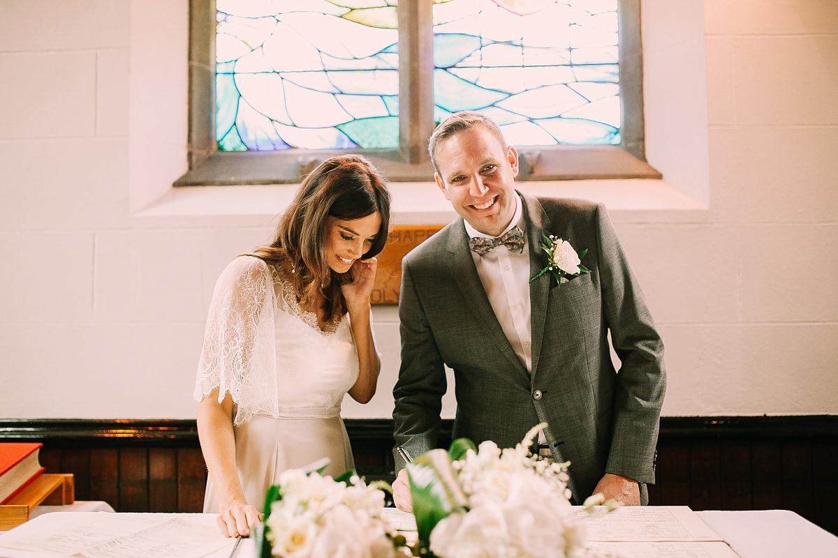 Bride Joanna wore an elegant Kate Beaumont gown for her modern, industrial chic style, minimalist and fuss-free wedding. Photography by Rosie Hardy.