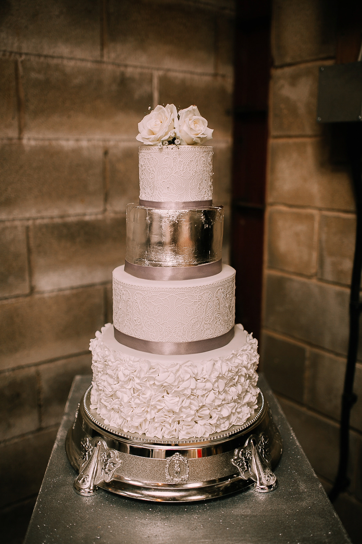 Bride Joanna wore an elegant Kate Beaumont gown for her modern, industrial chic style, minimalist and fuss-free wedding. Photography by Rosie Hardy.