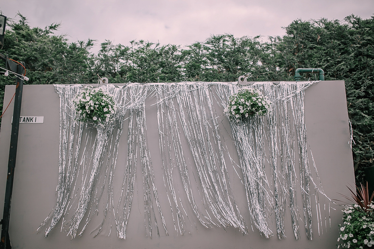 Bride Joanna wore an elegant Kate Beaumont gown for her modern, industrial chic style, minimalist and fuss-free wedding. Photography by Rosie Hardy.