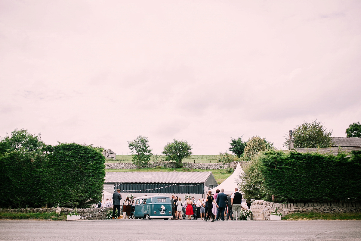 Bride Joanna wore an elegant Kate Beaumont gown for her modern, industrial chic style, minimalist and fuss-free wedding. Photography by Rosie Hardy.