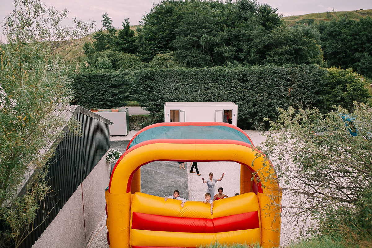 Bride Joanna wore an elegant Kate Beaumont gown for her modern, industrial chic style, minimalist and fuss-free wedding. Photography by Rosie Hardy.