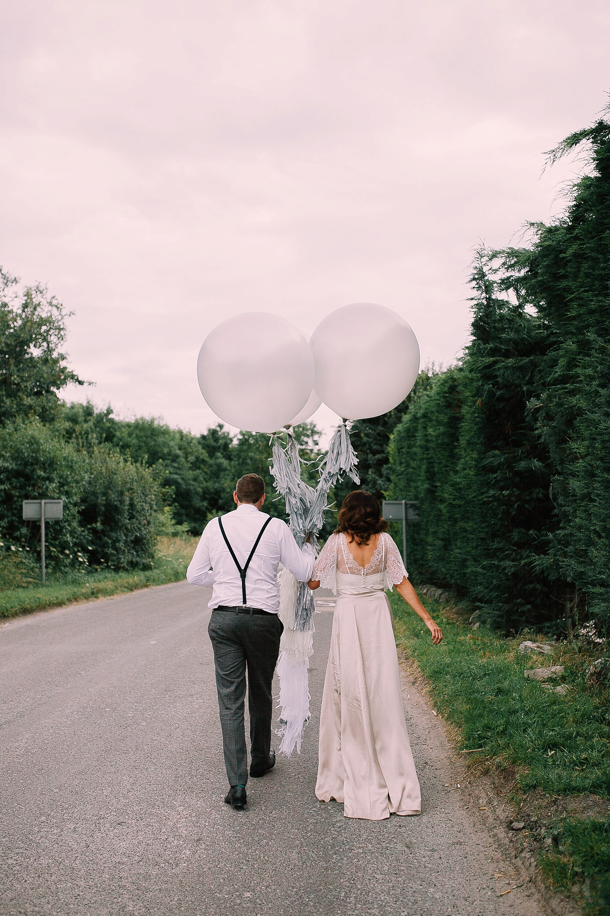 Bride Joanna wore an elegant Kate Beaumont gown for her modern, industrial chic style, minimalist and fuss-free wedding. Photography by Rosie Hardy.