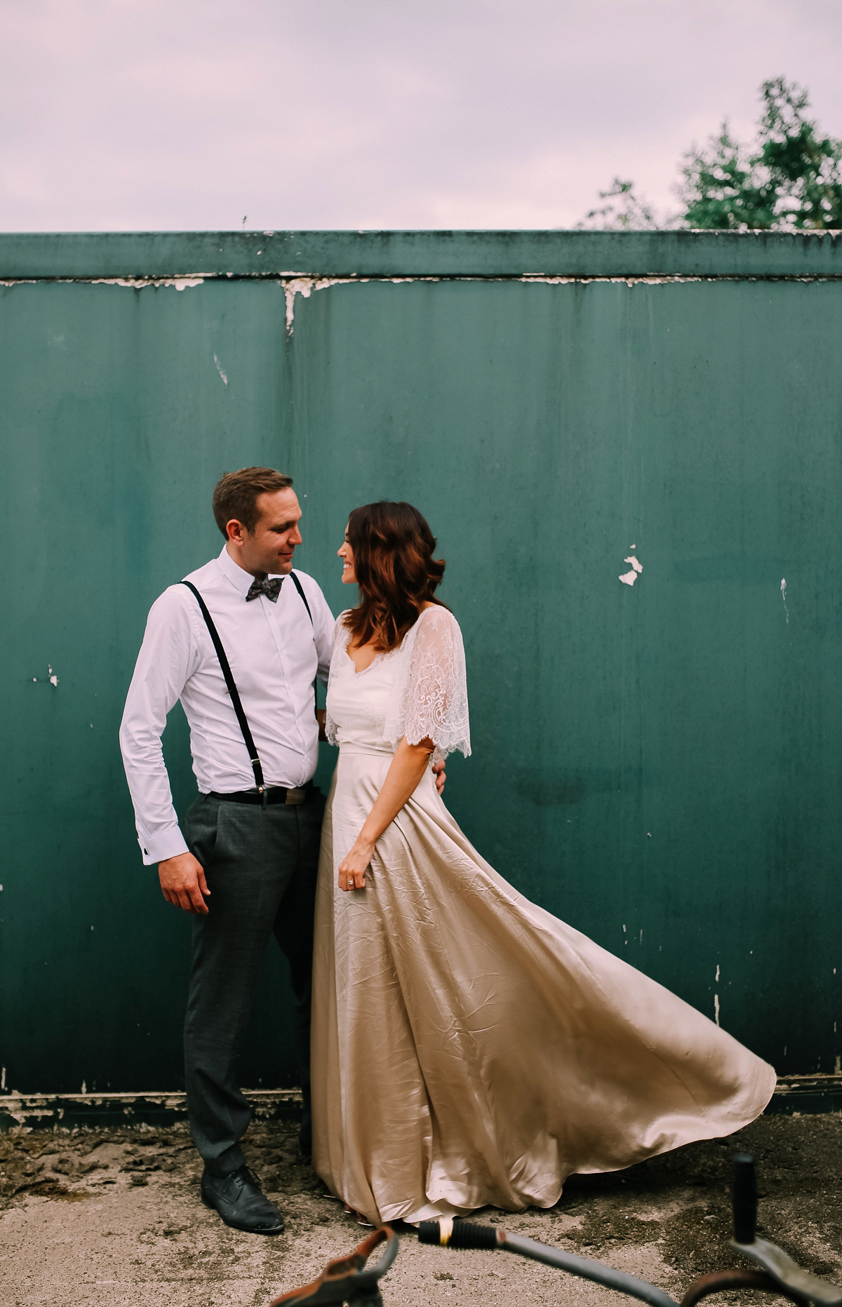 Bride Joanna wore an elegant Kate Beaumont gown for her modern, industrial chic style, minimalist and fuss-free wedding. Photography by Rosie Hardy.