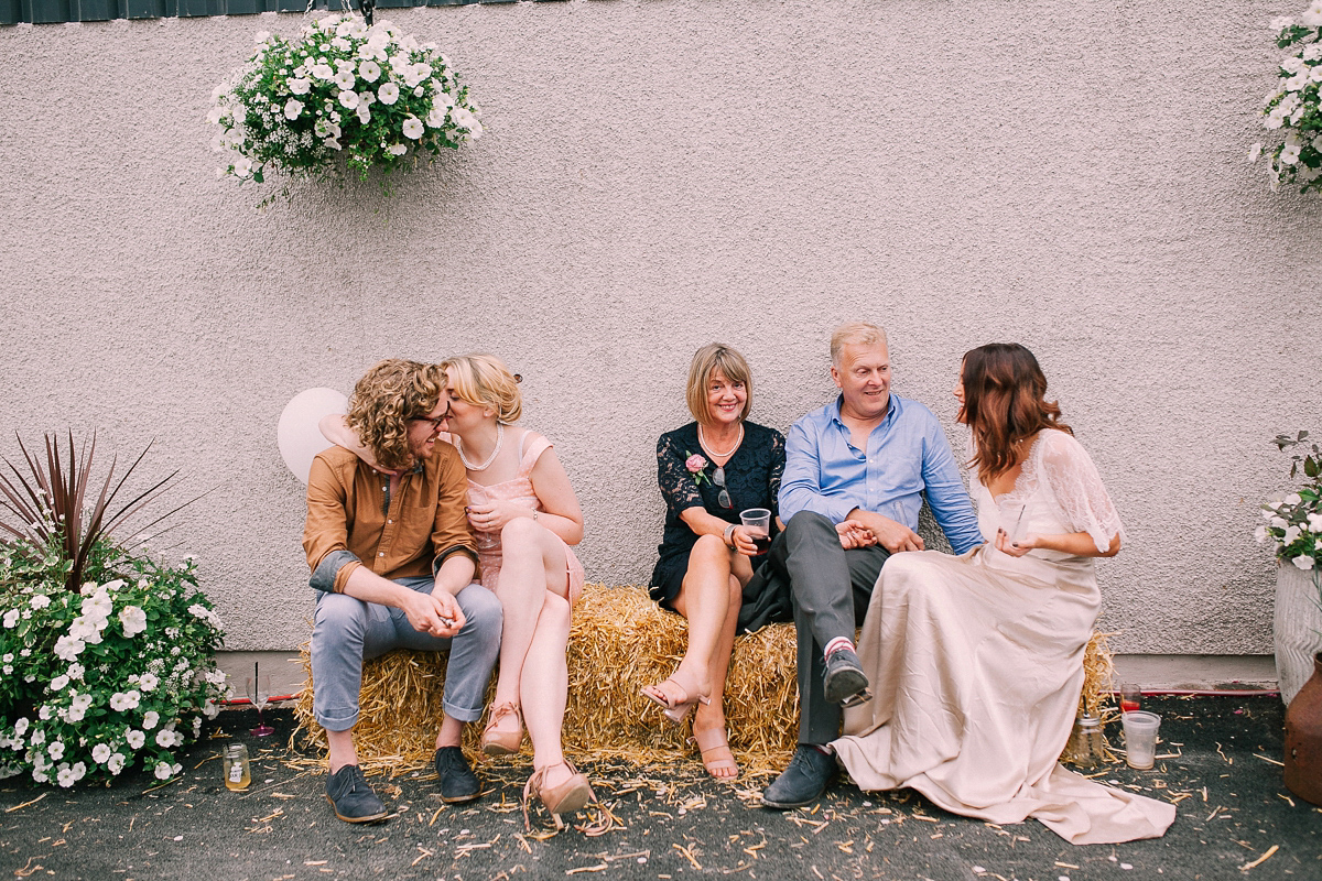 Bride Joanna wore an elegant Kate Beaumont gown for her modern, industrial chic style, minimalist and fuss-free wedding. Photography by Rosie Hardy.