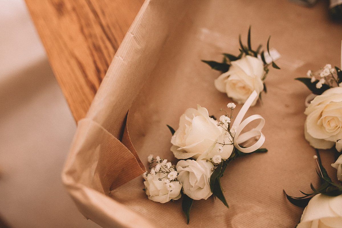 Bride Joanna wore an elegant Kate Beaumont gown for her modern, industrial chic style, minimalist and fuss-free wedding. Photography by Rosie Hardy.