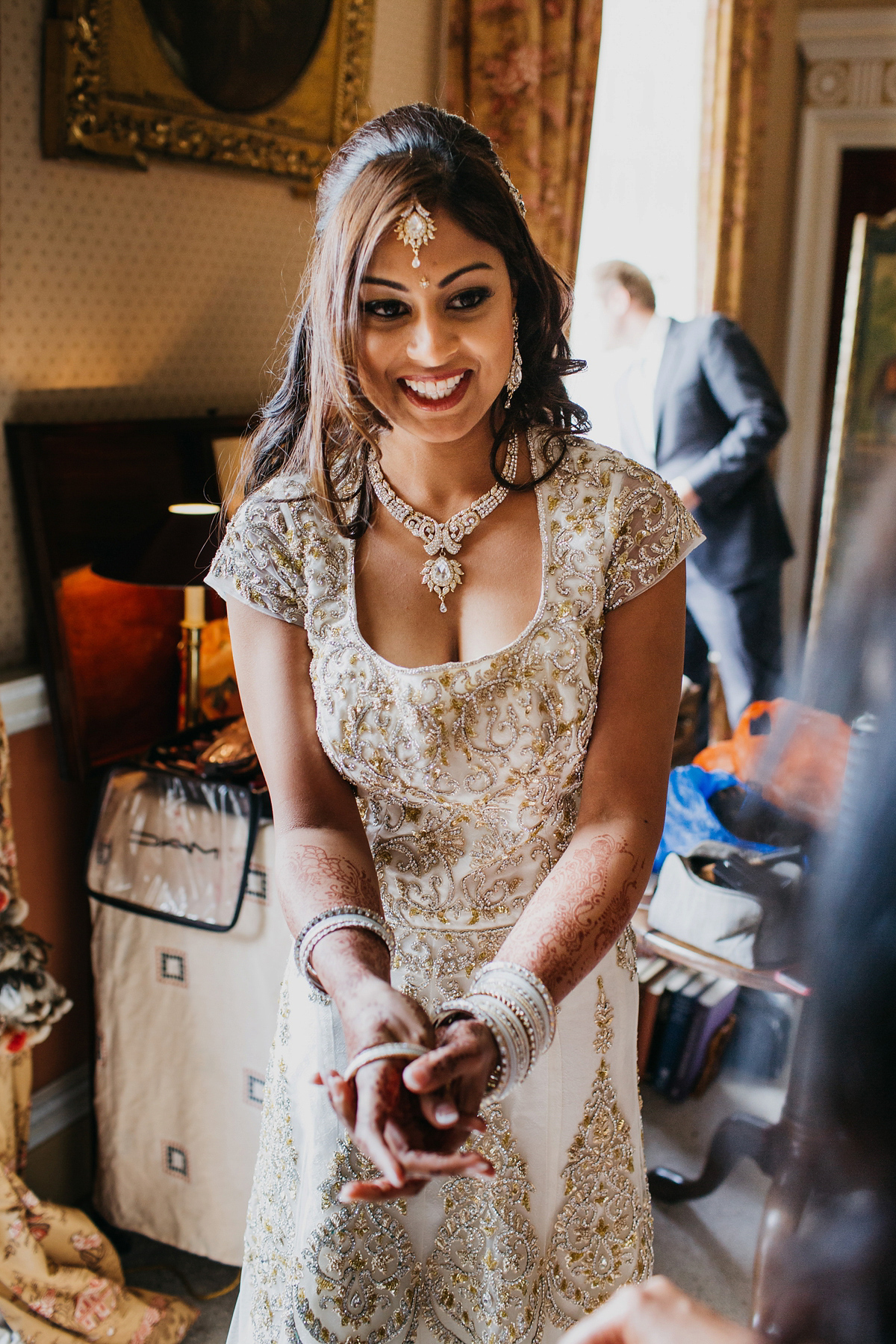 A vibrant Indian ceremony and elegant English fusion wedding in North Yorkshire. Photography by John Hope.