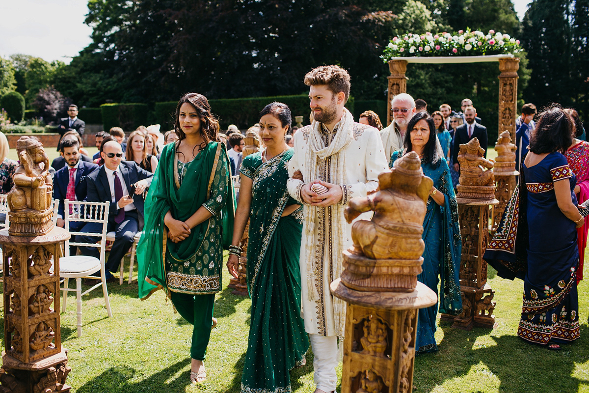 A vibrant Indian ceremony and elegant English fusion wedding in North Yorkshire. Photography by John Hope.