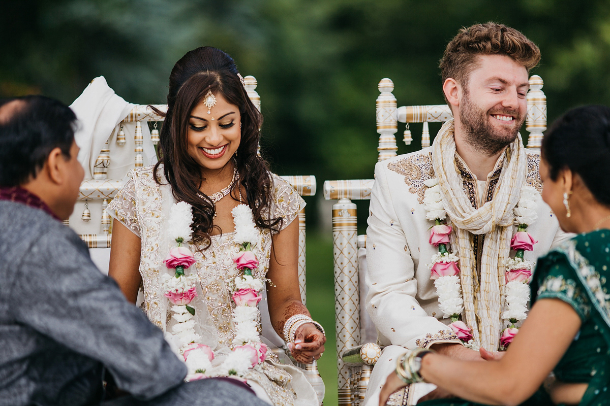 A vibrant Indian ceremony and elegant English fusion wedding in North Yorkshire. Photography by John Hope.