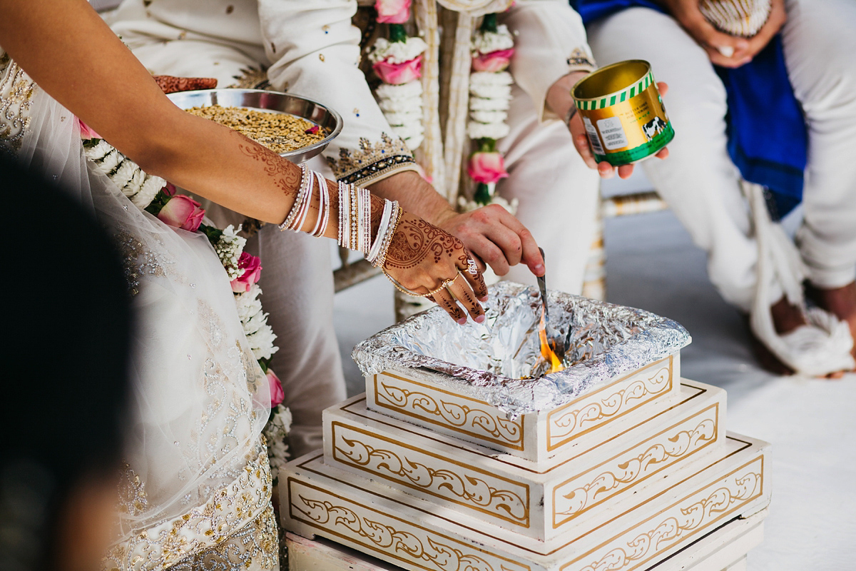 A vibrant Indian ceremony and elegant English fusion wedding in North Yorkshire. Photography by John Hope.