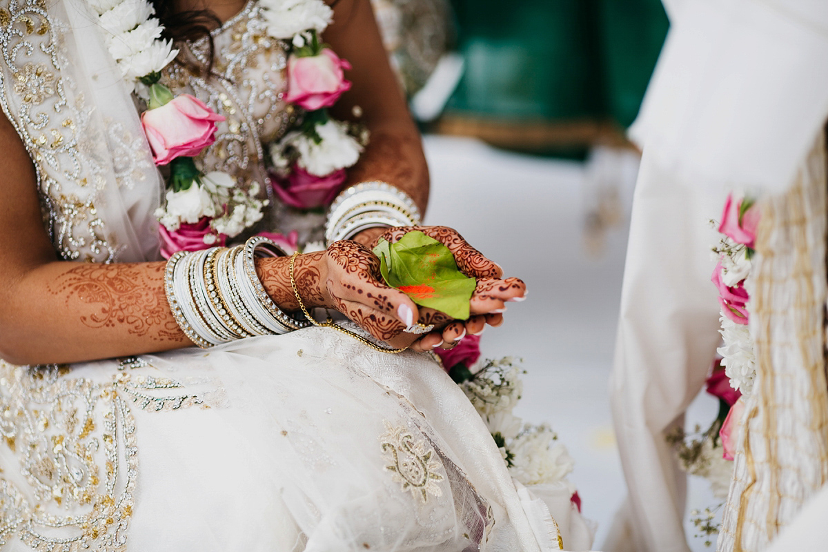 A vibrant Indian ceremony and elegant English fusion wedding in North Yorkshire. Photography by John Hope.