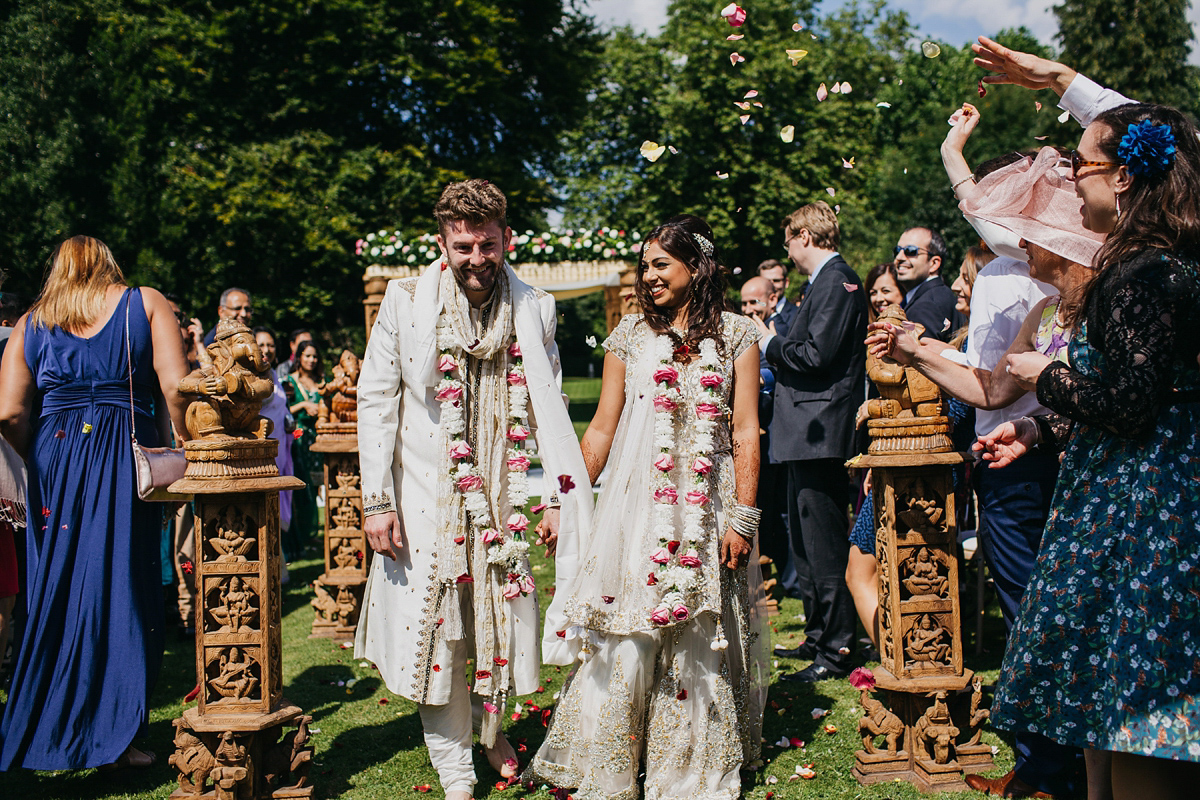 A vibrant Indian ceremony and elegant English fusion wedding in North Yorkshire. Photography by John Hope.