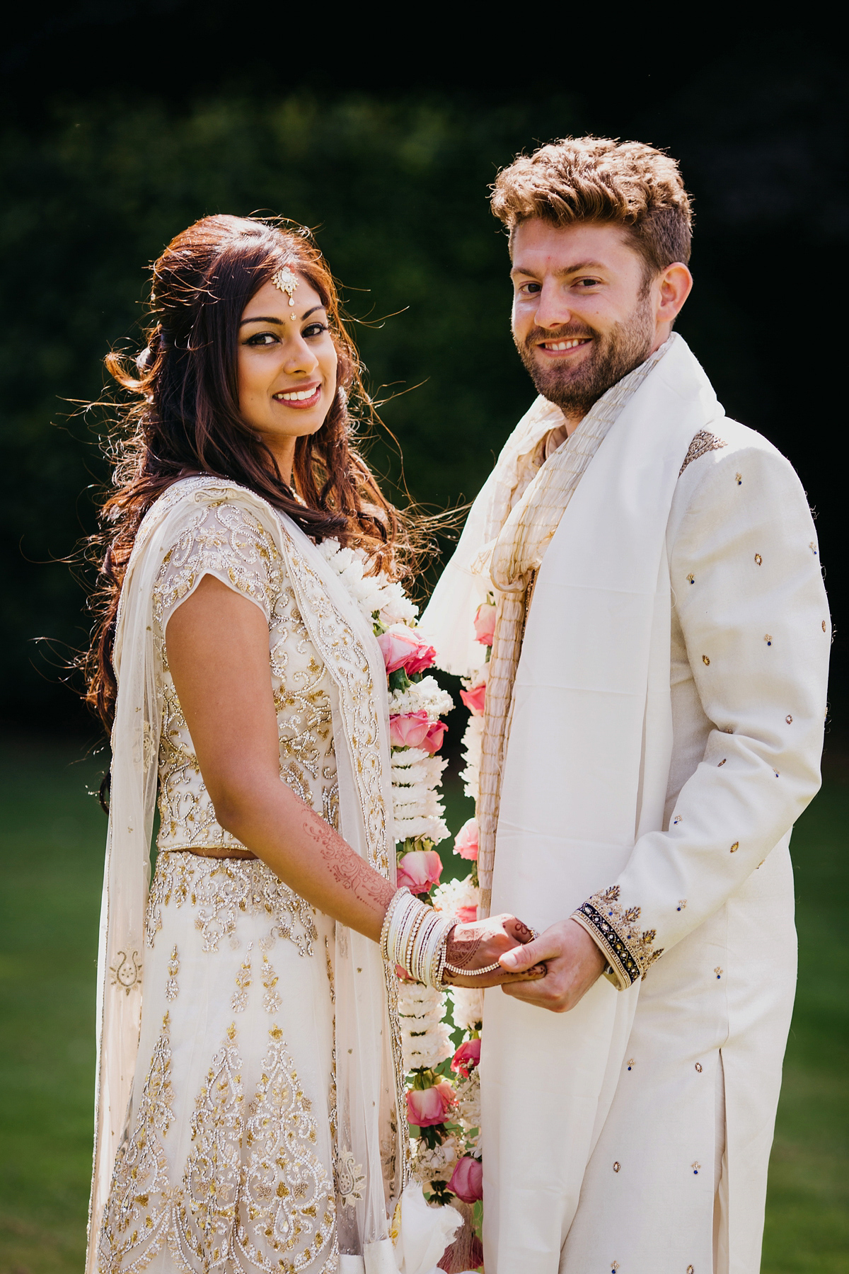 A vibrant Indian ceremony and elegant English fusion wedding in North Yorkshire. Photography by John Hope.