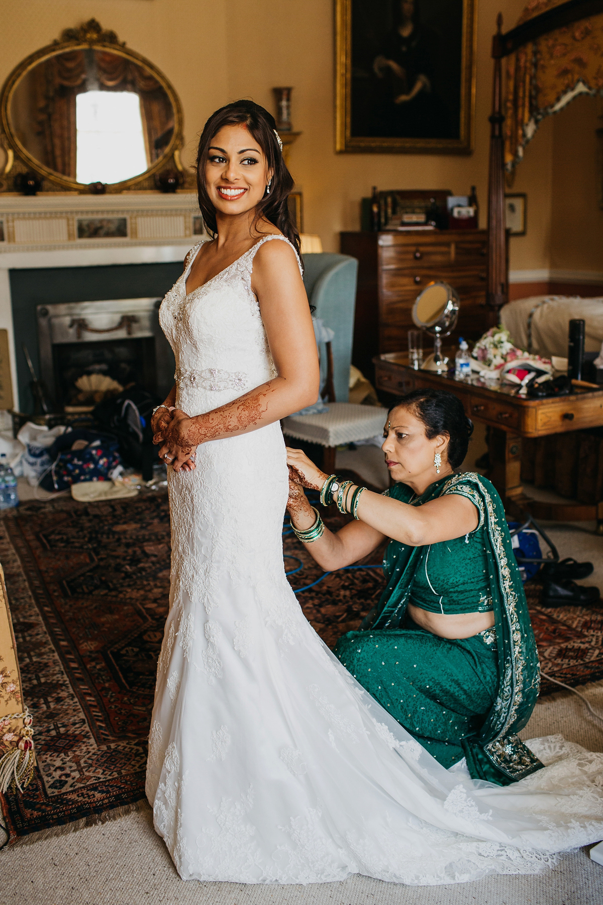 A vibrant Indian ceremony and elegant English fusion wedding in North Yorkshire. Photography by John Hope.