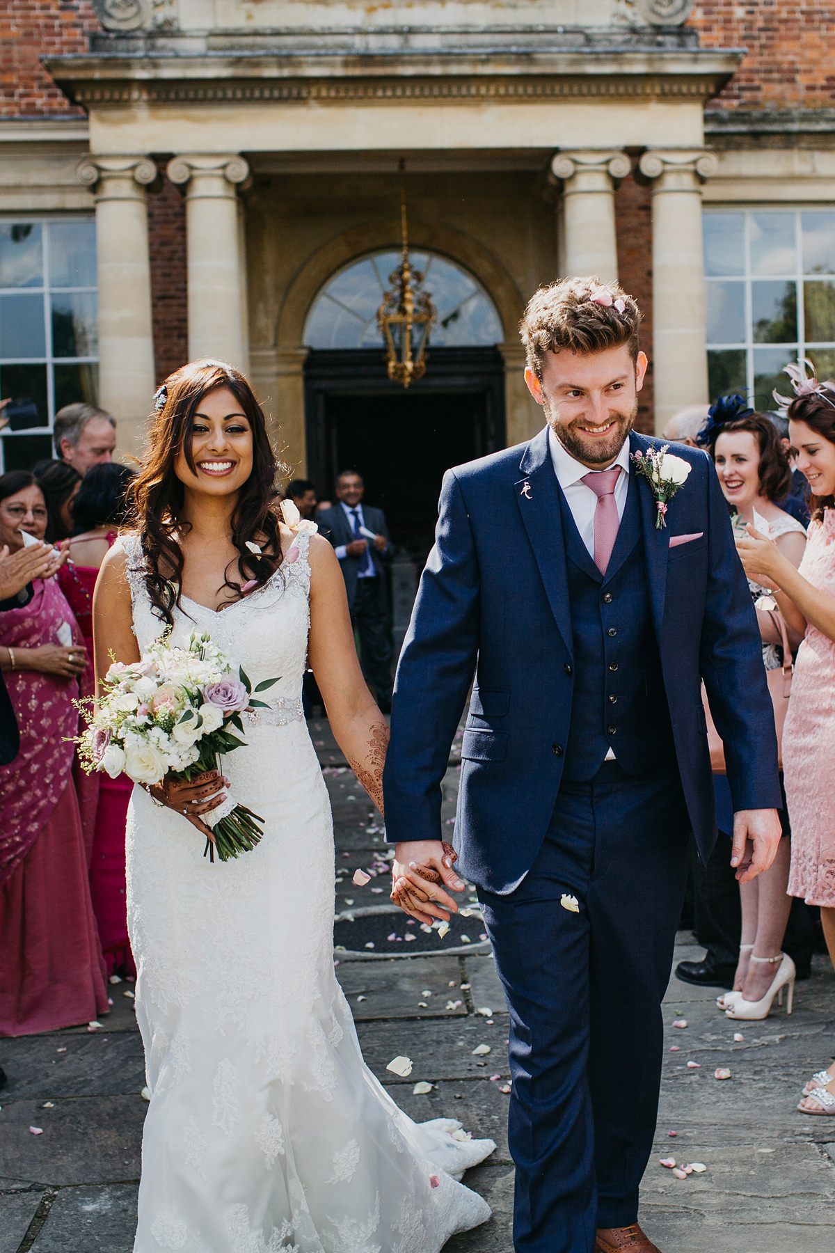 A vibrant Indian ceremony and elegant English fusion wedding in North Yorkshire. Photography by John Hope.