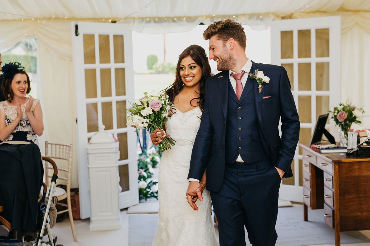 A vibrant Indian ceremony and elegant English fusion wedding in North Yorkshire. Photography by John Hope.