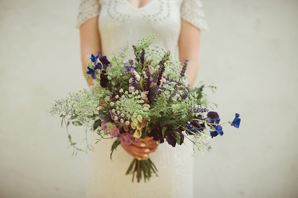 Bride Alison wears a beaded Eliza Jane Howell wedding dress for her glamorous and whimsical summer wedding. Captured by Tom Ravenshear Phtography.