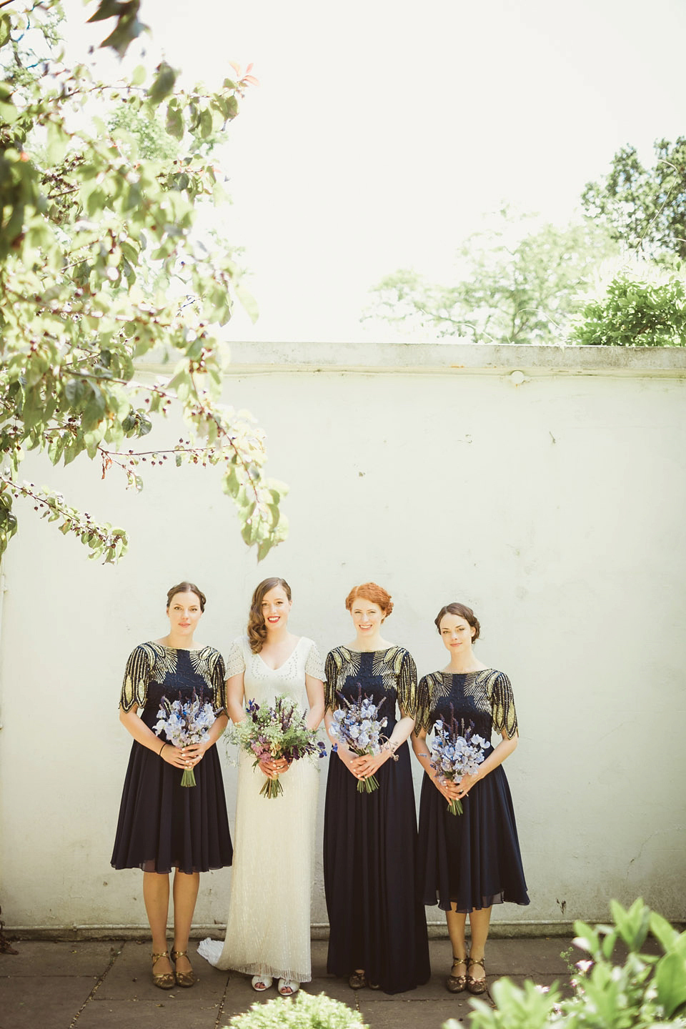 Bride Alison wears a beaded Eliza Jane Howell wedding dress for her glamorous and whimsical summer wedding. Captured by Tom Ravenshear Phtography.