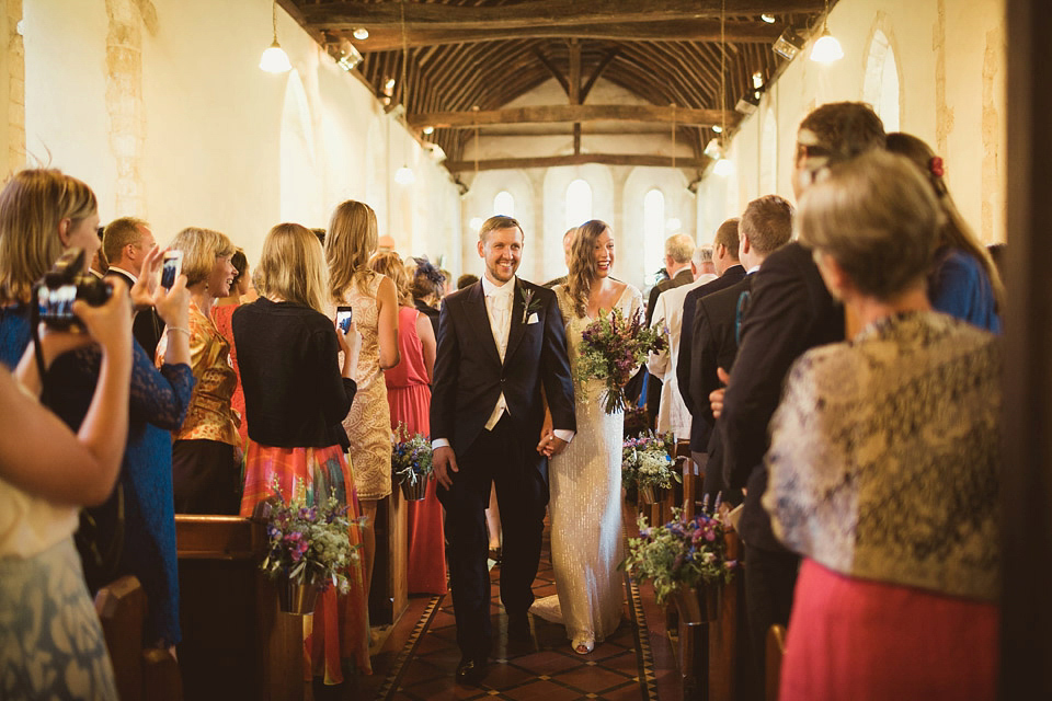 Bride Alison wears a beaded Eliza Jane Howell wedding dress for her glamorous and whimsical summer wedding. Captured by Tom Ravenshear Phtography.