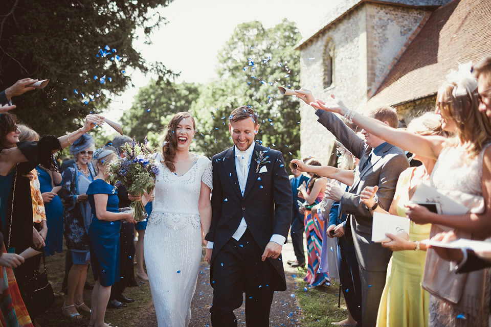 Bride Alison wears a beaded Eliza Jane Howell wedding dress for her glamorous and whimsical summer wedding. Captured by Tom Ravenshear Phtography.