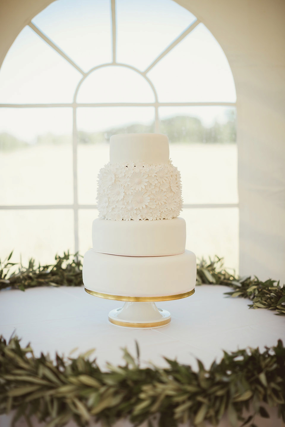 Bride Alison wears a beaded Eliza Jane Howell wedding dress for her glamorous and whimsical summer wedding. Captured by Tom Ravenshear Phtography.