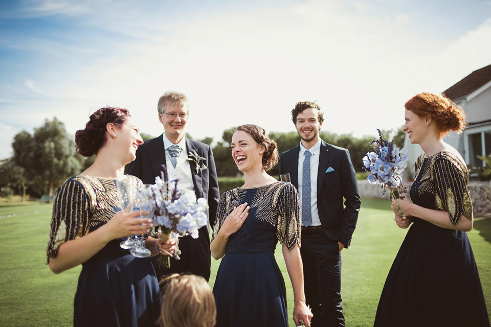 Bride Alison wears a beaded Eliza Jane Howell wedding dress for her glamorous and whimsical summer wedding. Captured by Tom Ravenshear Phtography.