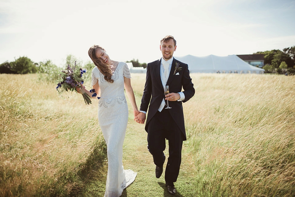 Bride Alison wears a beaded Eliza Jane Howell wedding dress for her glamorous and whimsical summer wedding. Captured by Tom Ravenshear Phtography.