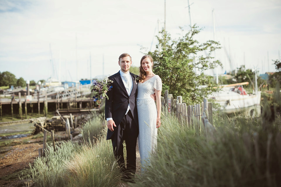 Bride Alison wears a beaded Eliza Jane Howell wedding dress for her glamorous and whimsical summer wedding. Captured by Tom Ravenshear Phtography.